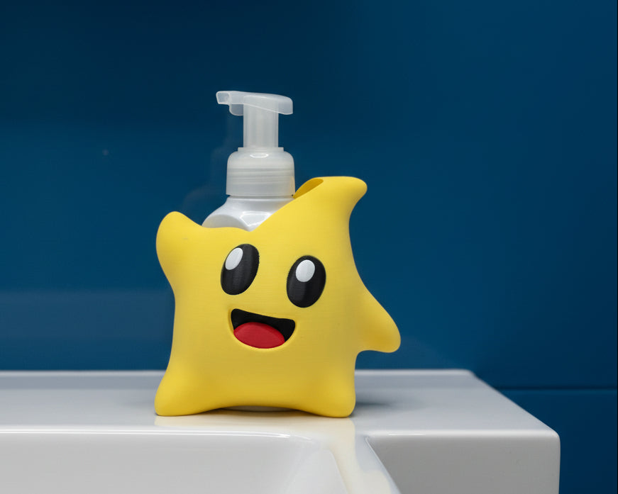 A yellow star-shaped foam bottle cover with a cute cartoon face, shown holding a clear pump dispenser against a white studio background.