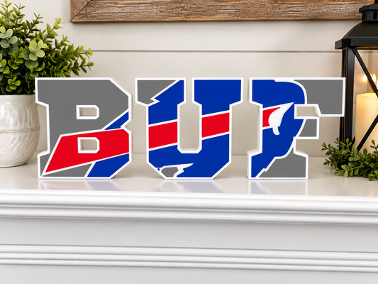 3D printed BUF football decor in classic blue red and white colors displayed on a white mantel