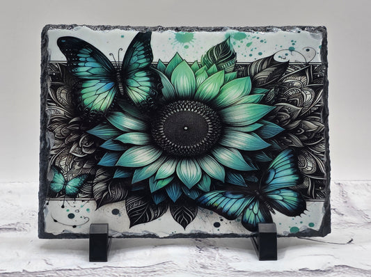 Decorative slate with a floral and butterfly design on a white background